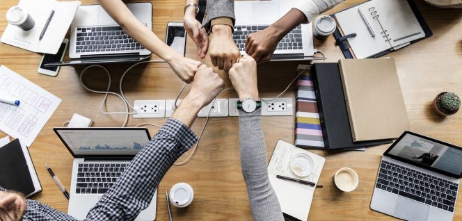 
 Colleagues giving a fist bump